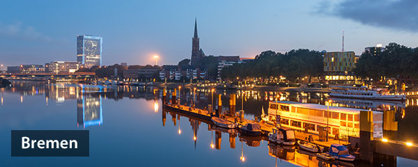 Image of reflection of Bremen skyline in the calm waters of river Weser, In Bremen, Germany