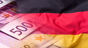 Living Costs & Expenses in Germany - An image of the German flag and euro currency. Flag money conce